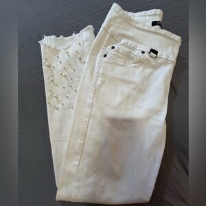 Lisette white jeans with pearl studs on lower leg